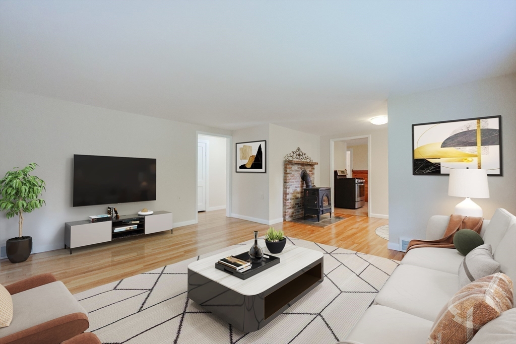 17 Chace Avenue Pepperell, MA 01463 - Photo 13 of 29 a living room with furniture and a flat screen tv
