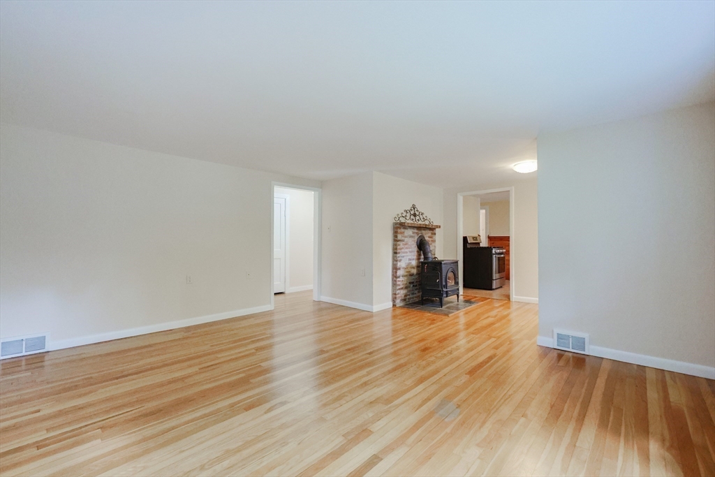 17 Chace Avenue Pepperell, MA 01463 - Photo 14 of 29 a view of empty room with wooden floor