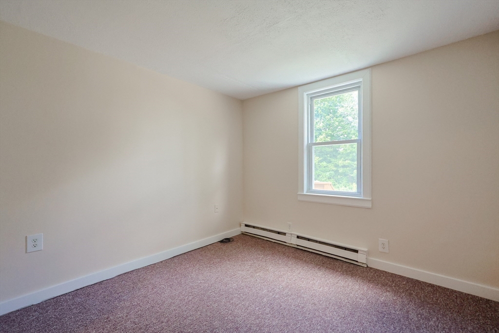 17 Chace Avenue Pepperell, MA 01463 - Photo 18 of 29 an empty room with a window