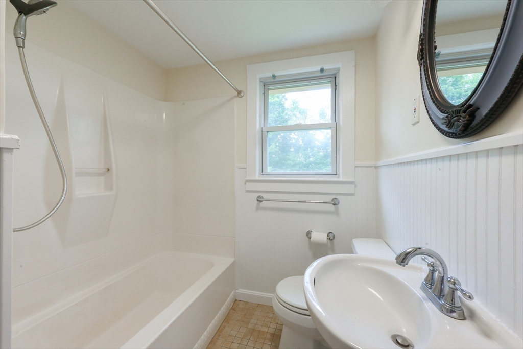 17 Chace Avenue Pepperell, MA 01463 - Photo 23 of 29 a bathroom with a sink a toilet and a bathtub
