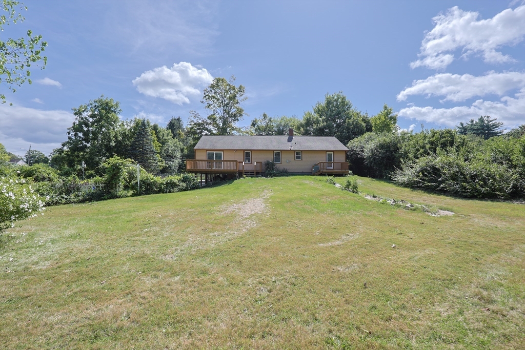 17 Chace Avenue Pepperell, MA 01463 - Photo 24 of 29 a swimming pool with trees in the background