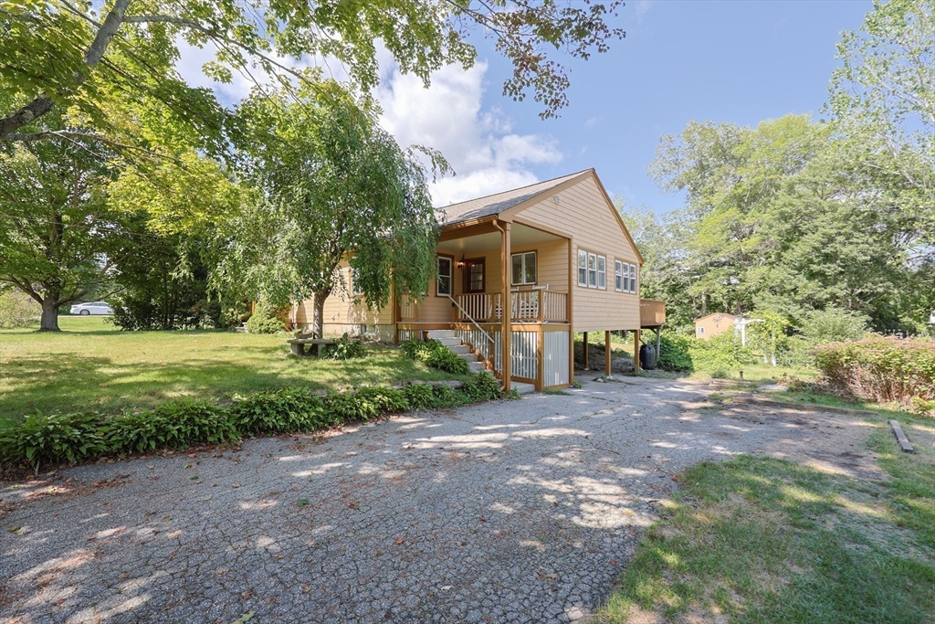 17 Chace Avenue Pepperell, MA 01463 - Photo 27 of 29 a view of a house with backyard and garden