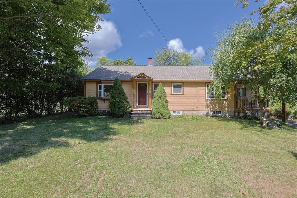17 Chace Avenue Pepperell, MA 01463 - Photo 28 of 29 a front view of a house with a garden