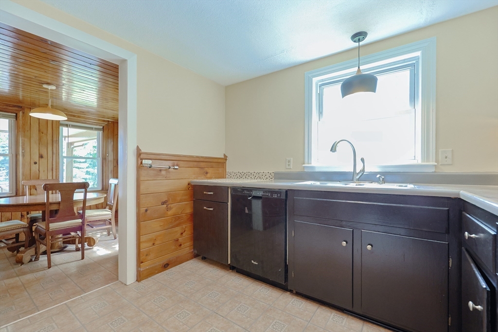 17 Chace Avenue Pepperell, MA 01463 - Photo 10 of 29 a bathroom with a sink a mirror and a bathtub