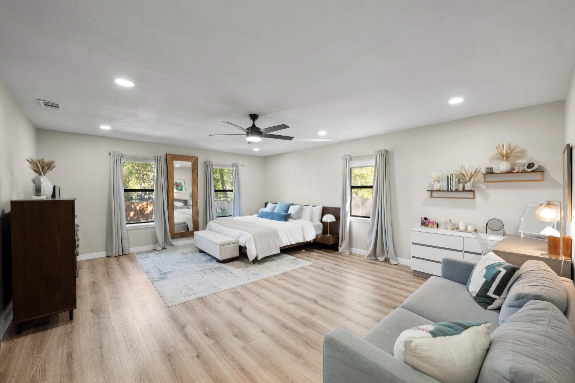 1006 Hollybluff Street Austin, TX 78753 - Photo 14 of 27 Bedroom featuring light wood-type flooring, recessed lighting, and a ceiling fan