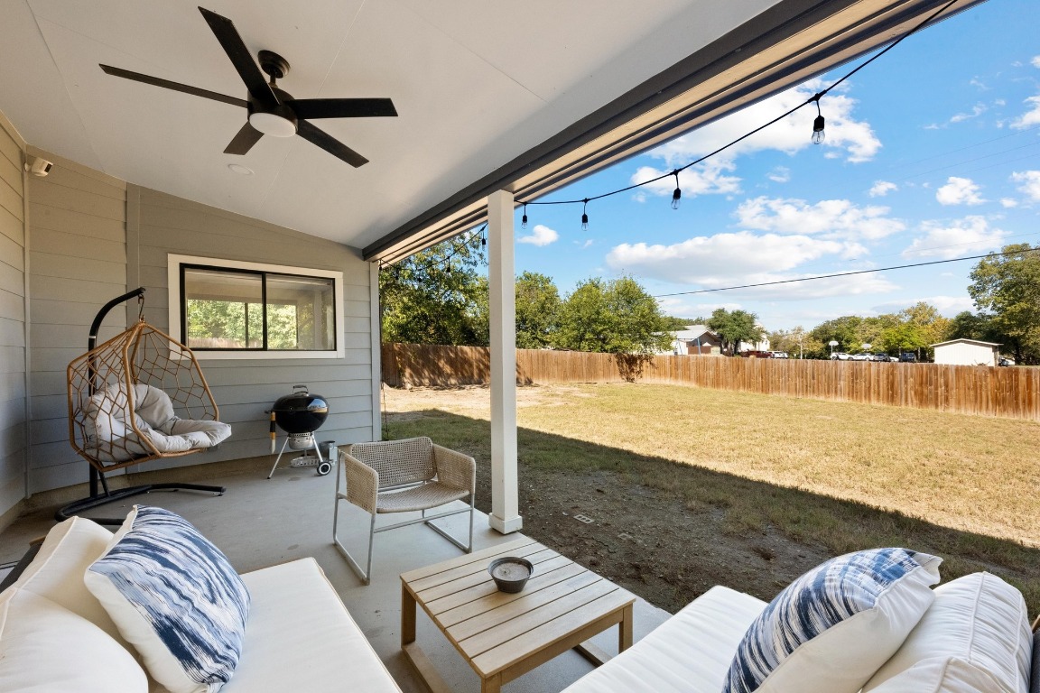 1006 Hollybluff Street Austin, TX 78753 - Photo 22 of 27 Fenced backyard with an outdoor living space, a patio area, a ceiling fan, and area for grilling