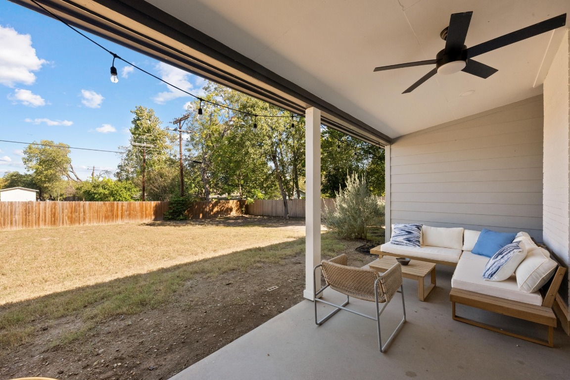 1006 Hollybluff Street Austin, TX 78753 - Photo 23 of 27 Fenced backyard with a patio area, an outdoor living space, and ceiling fan
