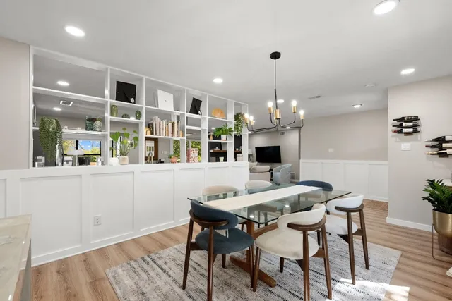 a view of a dining room with furniture and wooden floor