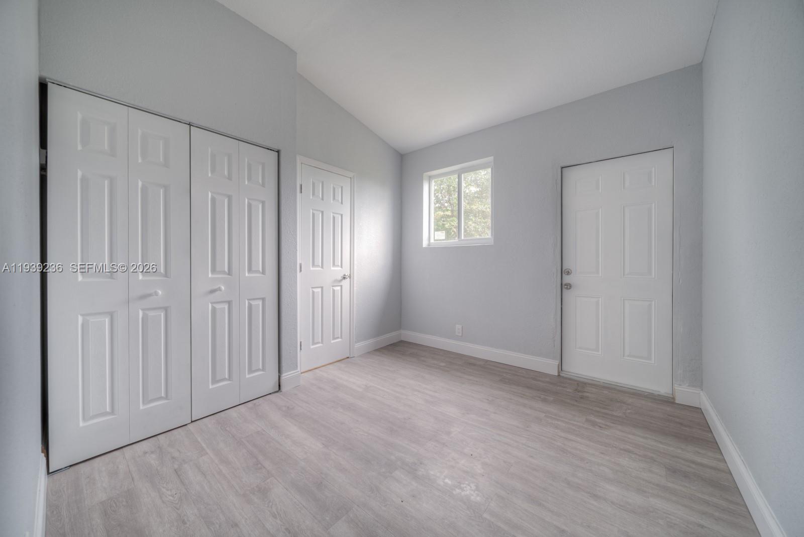 10290 Southwest 177th Street, Unit 10290 Miami, FL 33157 - Photo 14 of 16 an empty room with windows