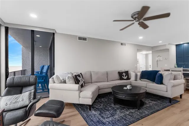 a living room with furniture and a rug