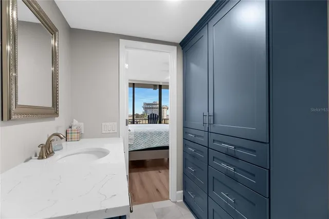 a en suite bathroom with a sink and a mirror