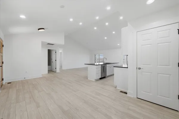 a bedroom with a bed and a couch
