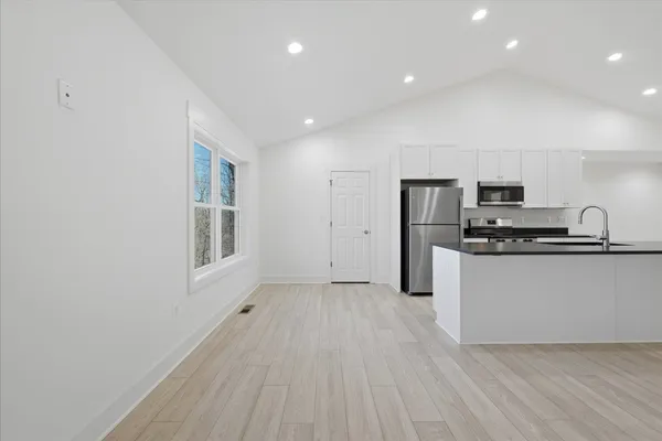 a view of an empty room with a fan