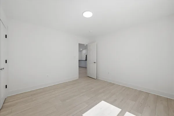 a bathroom with a shower a toilet and a sink