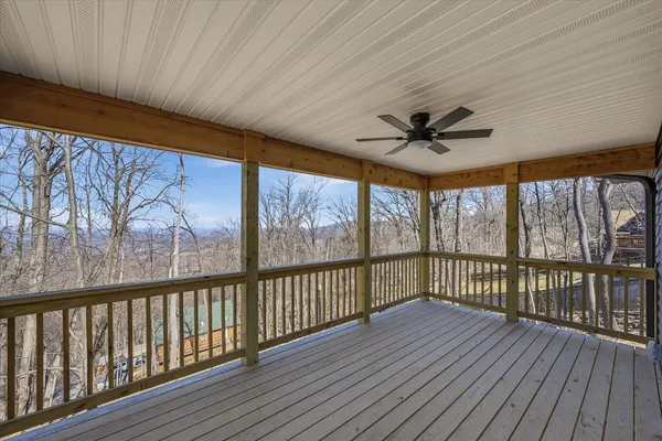 a view of a balcony with a ceiling fan