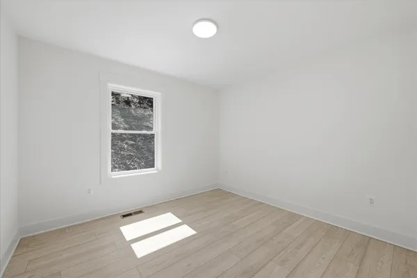 an aerial view of a house with outdoor space