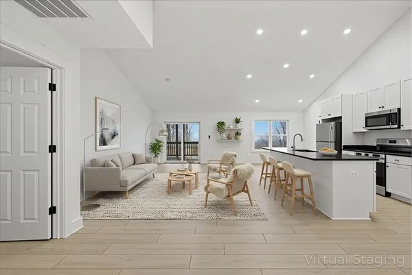 a view of kitchen with sink and microwave