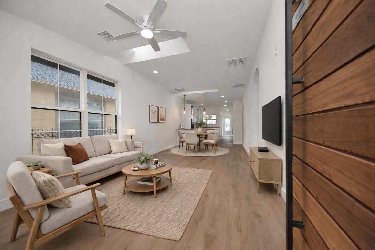 427 North Milby Street Houston, TX 77003 - Photo 3 of 44 Bright, open-concept living space filled with natural light and modern finishes throughout. Spacious layout flows seamlessly into the kitchen, perfect for entertaining. Stylish and move-in ready with a clean, contemporary feel.