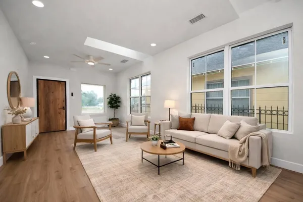 a kitchen with stainless steel appliances a refrigerator sink and microwave