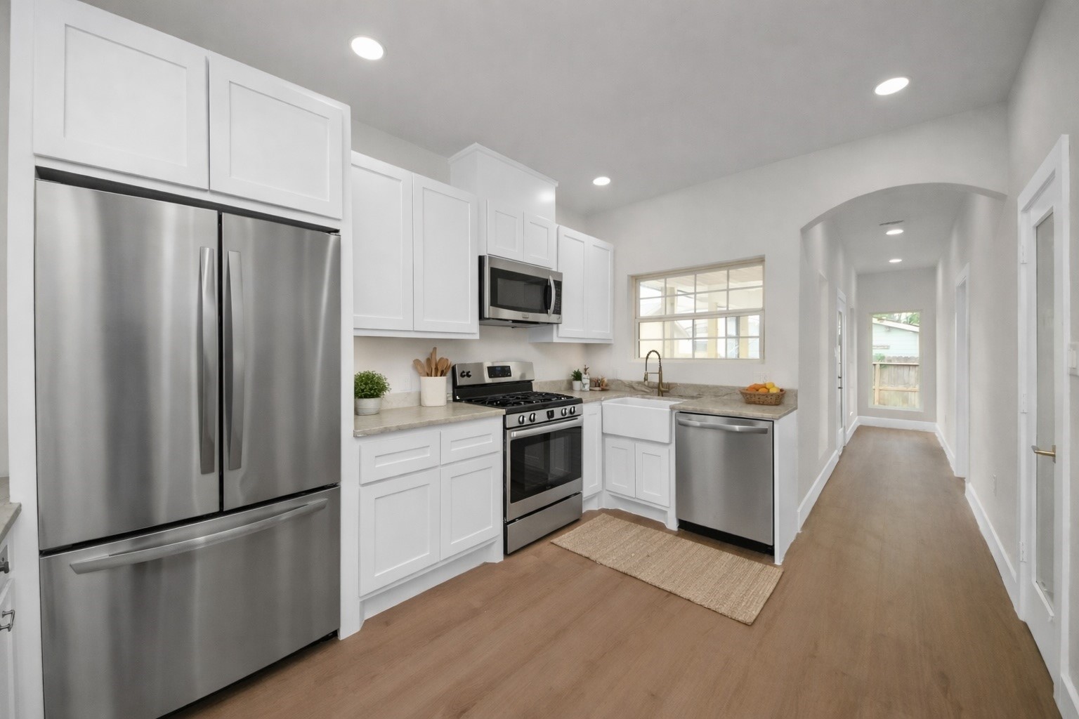 427 North Milby Street Houston, TX 77003 - Photo 5 of 44 Bright and functional kitchen with custom cabinetry, quartz countertops, and modern finishes. Thoughtfully designed layout offers ample storage and prep space. Clean, stylish, and ready for everyday living.