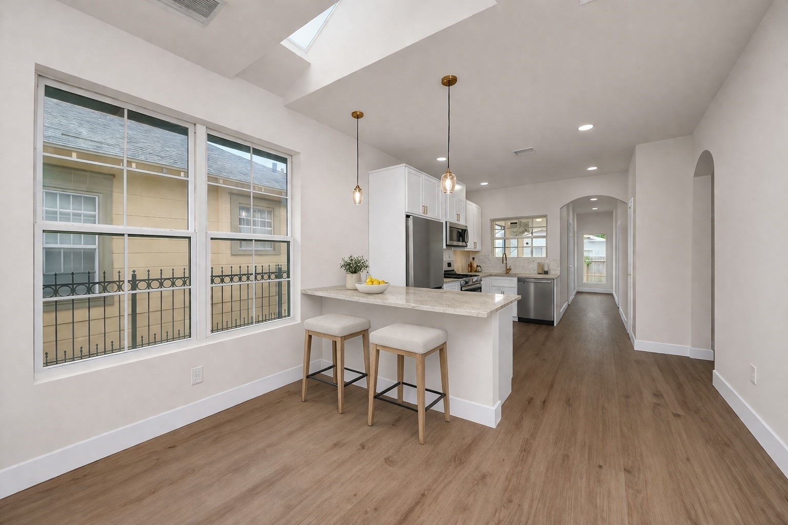 427 North Milby Street Houston, TX 77003 - Photo 10 of 44 Light-filled open layout with oversized windows and sleek modern finishes. Seamless flow into the kitchen makes it perfect for entertaining. Bright, airy, and designed for comfortable everyday living.