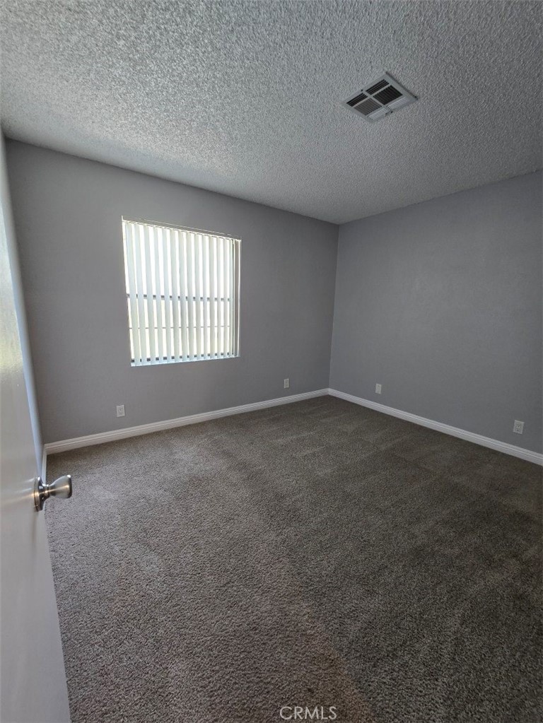 45200 Deep Canyon Road Palm Desert, CA 92260 - Photo 11 of 14 an empty room with windows