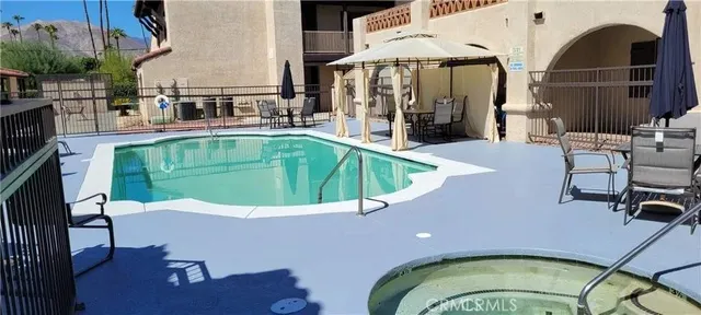 a view of a swimming pool with a lounge chairs