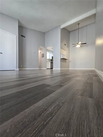 a view of a livingroom with wooden floor