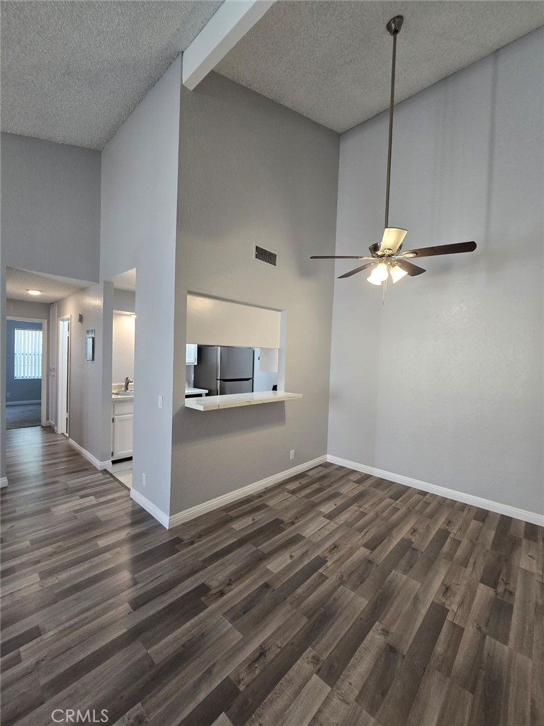 45200 Deep Canyon Road Palm Desert, CA 92260 - Photo 4 of 14 a view of empty room with wooden floor and fan