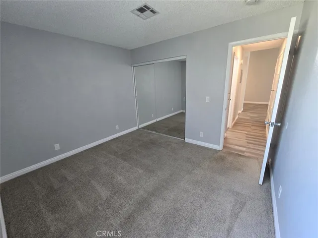 an empty room with a hallway