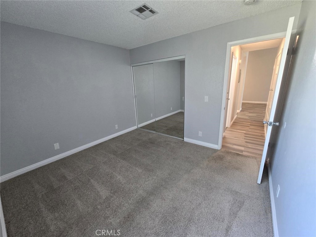 45200 Deep Canyon Road Palm Desert, CA 92260 - Photo 9 of 14 an empty room with a hallway