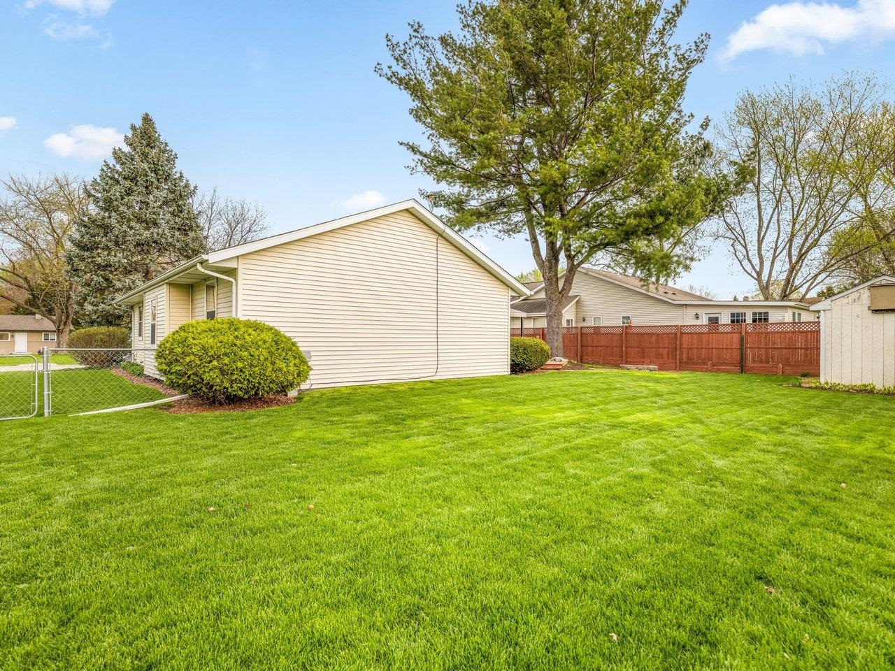 1816 Post Road Beloit, WI 53511 - Photo 42 of 42 a backyard of a house with a large tree