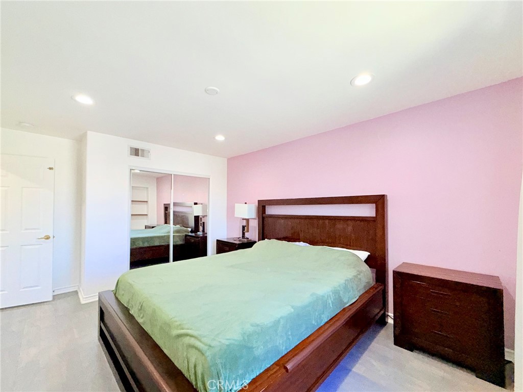 25714 Wallace Place Stevenson Ranch, CA 91381 - Photo 20 of 24 a bed sitting in a bedroom and kitchen view