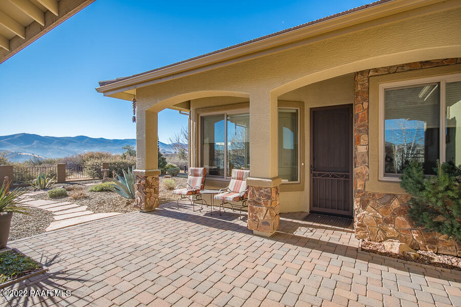 1594 Rustling Wind Place Prescott, AZ 86301 - Photo 11 of 47 a building exterior with furniture and outdoor space