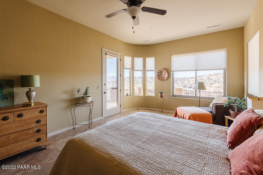 1594 Rustling Wind Place Prescott, AZ 86301 - Photo 23 of 47 a bedroom with a bed and a window