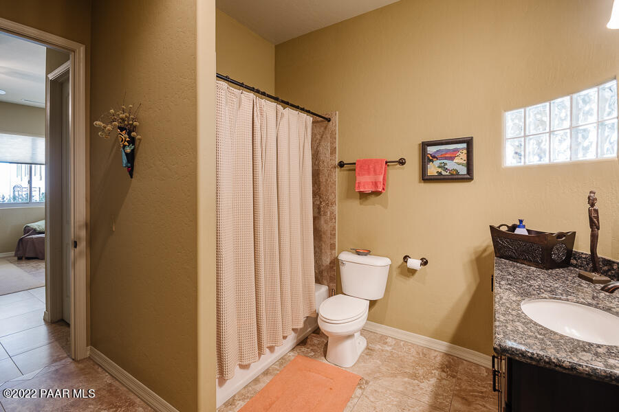1594 Rustling Wind Place Prescott, AZ 86301 - Photo 33 of 47 a bathroom with a granite countertop sink and a mirror