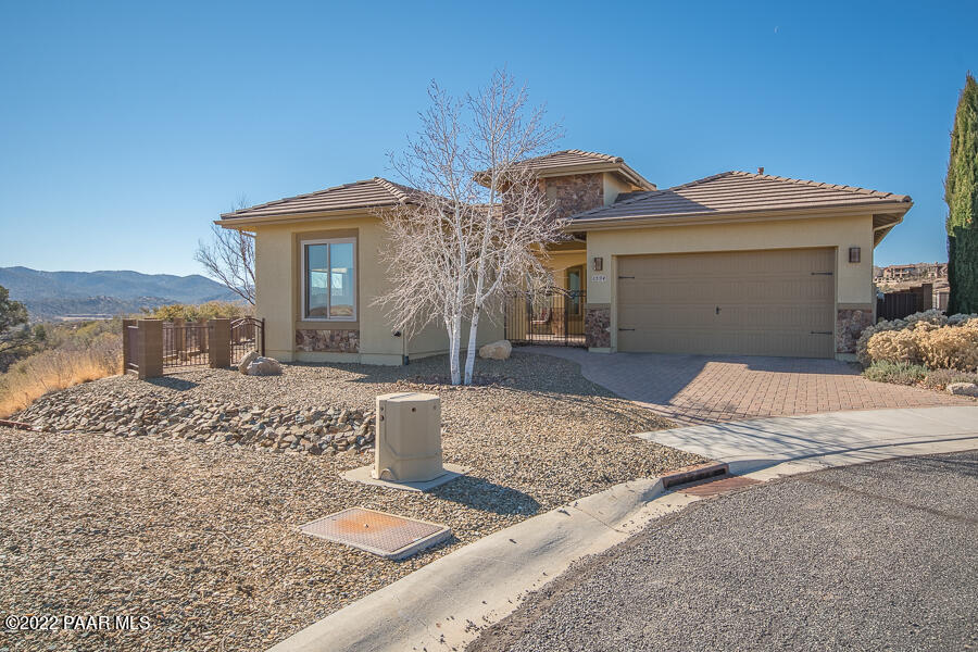 1594 Rustling Wind Place Prescott, AZ 86301 - Photo 4 of 47 a front view of a house with a yard