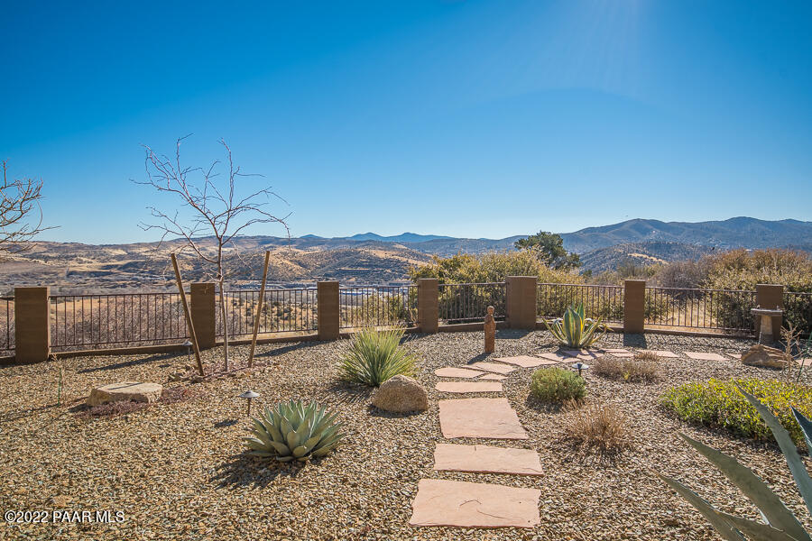 1594 Rustling Wind Place Prescott, AZ 86301 - Photo 6 of 47 a view of a backyard with sitting area