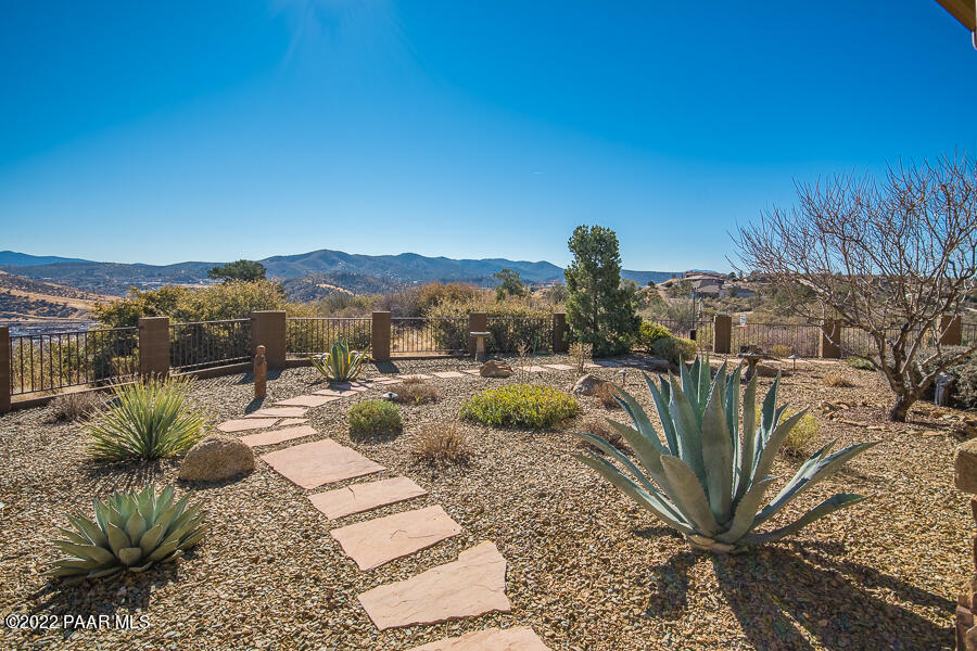 1594 Rustling Wind Place Prescott, AZ 86301 - Photo 8 of 47 a view of a fire pit with a yard