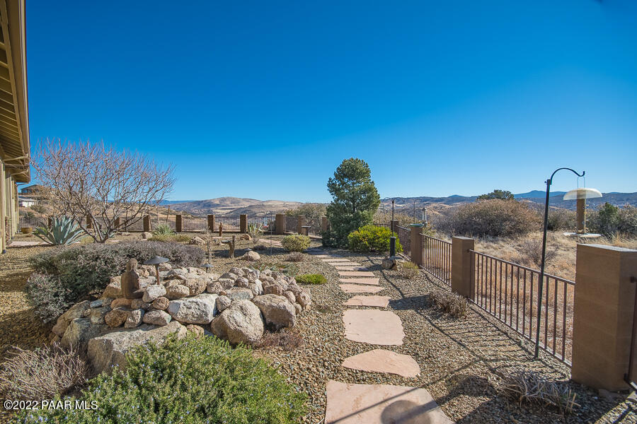 1594 Rustling Wind Place Prescott, AZ 86301 - Photo 9 of 47 a view of a house with wooden fence