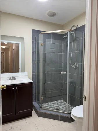 a bathroom with a shower and a sink