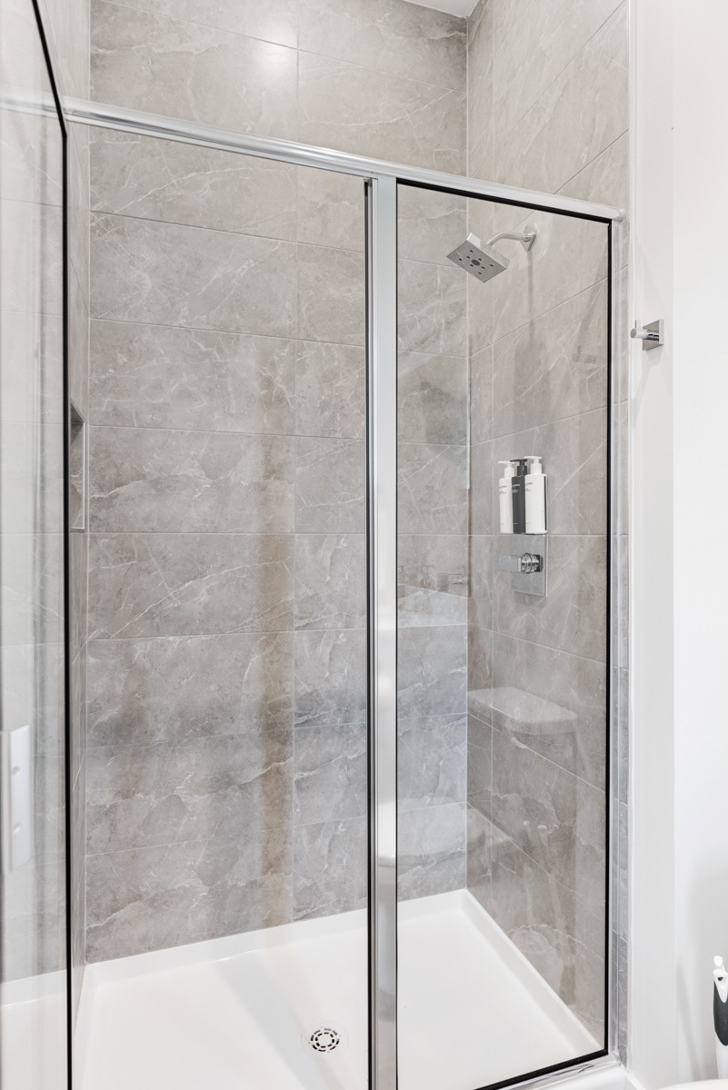 1233 Lischey Avenue Nashville, TN 37207 - Photo 15 of 89 a bathroom with a glass shower door