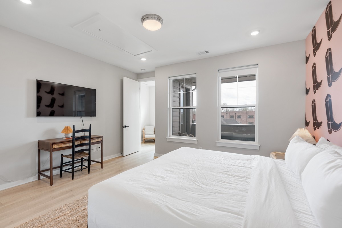 1233 Lischey Avenue Nashville, TN 37207 - Photo 22 of 89 a bedroom with a bed and a flat screen tv