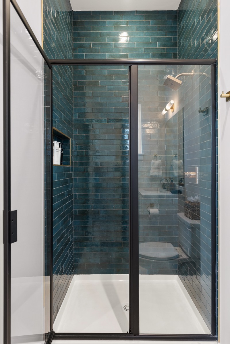 1233 Lischey Avenue Nashville, TN 37207 - Photo 44 of 89 a bathroom with a glass shower door