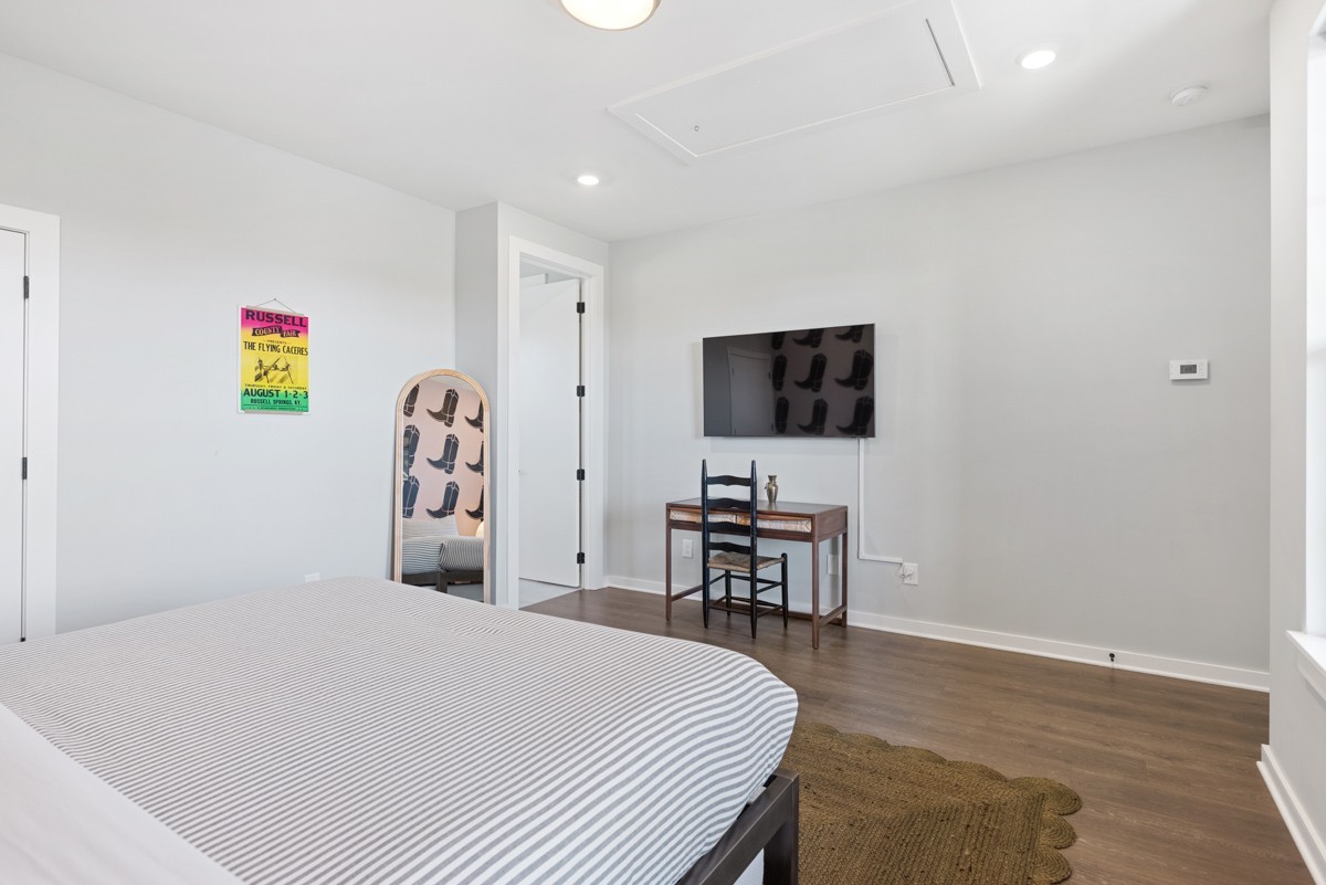 1233 Lischey Avenue Nashville, TN 37207 - Photo 51 of 89 a bedroom with a bed and a flat screen tv