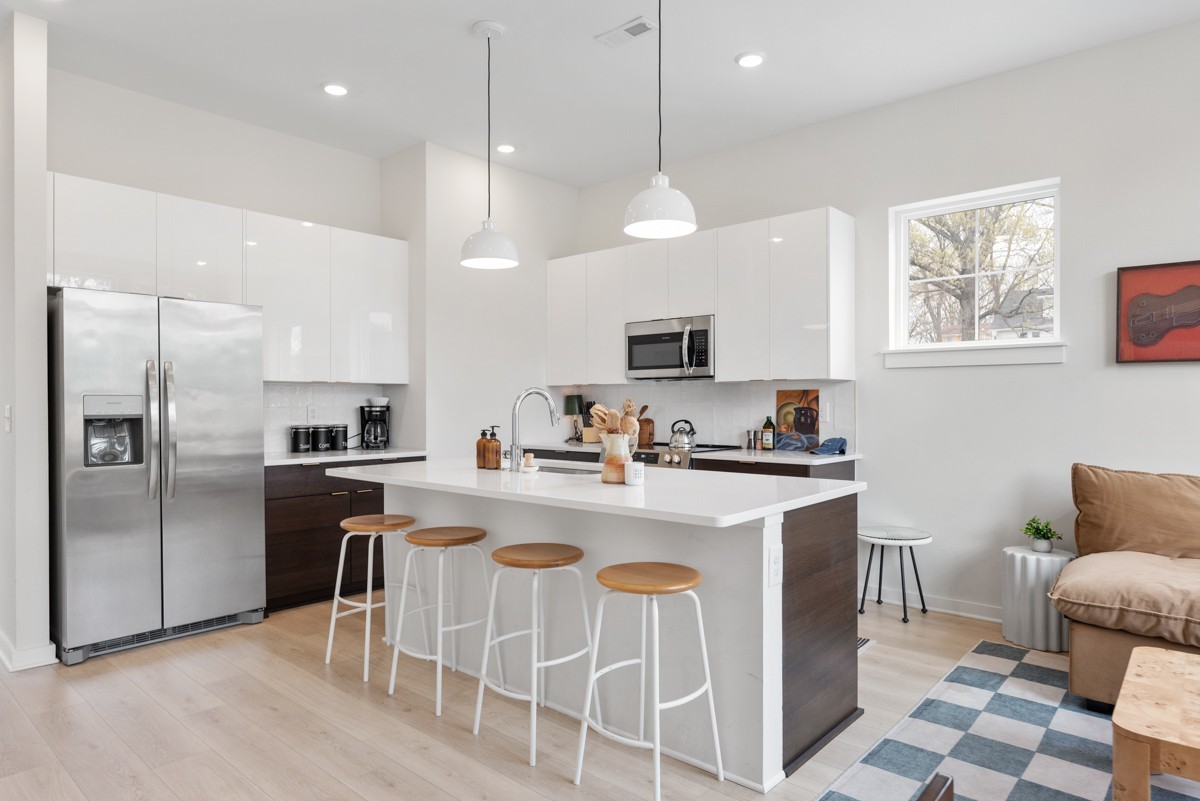 1233 Lischey Avenue Nashville, TN 37207 - Photo 69 of 89 a kitchen with cabinets a sink stainless steel appliances and a window