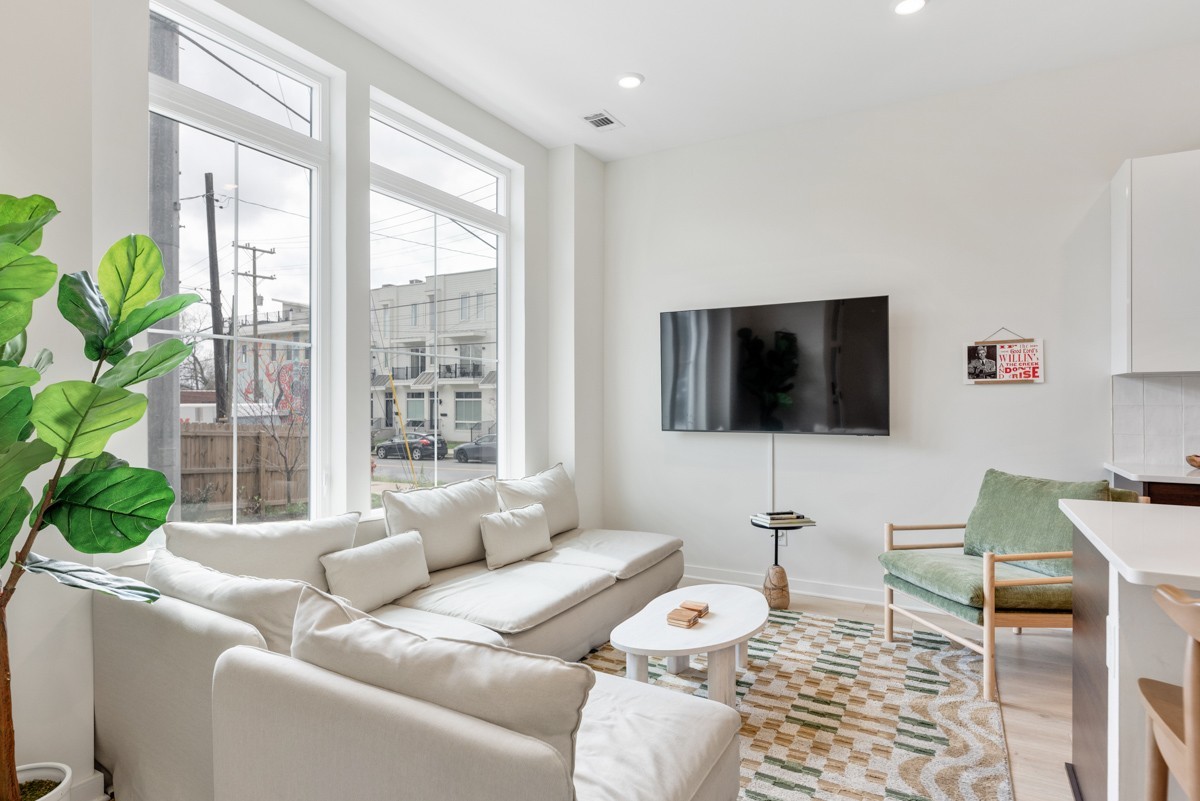 1233 Lischey Avenue Nashville, TN 37207 - Photo 7 of 89 a living room with furniture and a flat screen tv