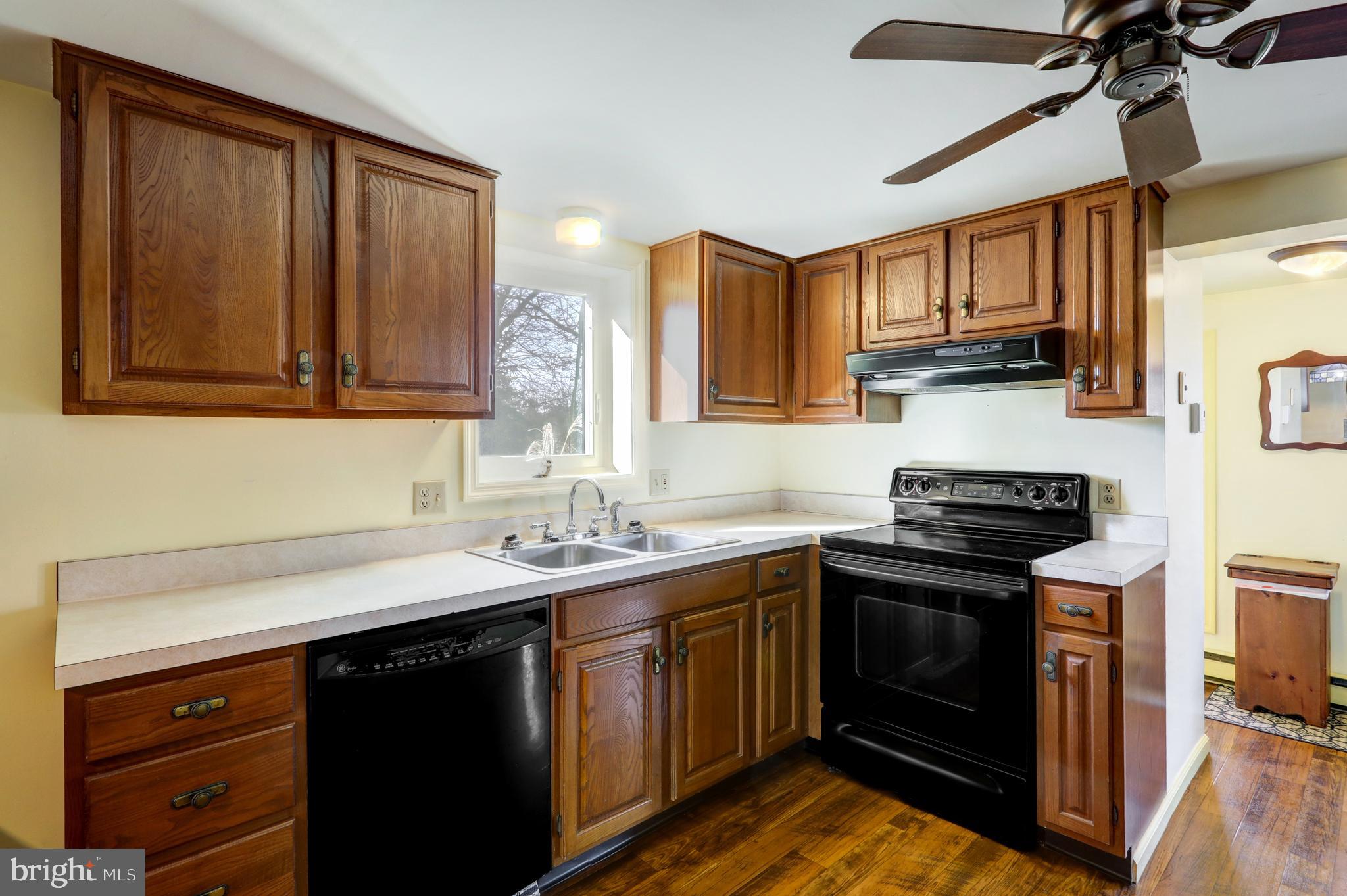 206 Pleasant Hill Drive Lititz, PA 17543 - Photo 19 of 35 a kitchen with stainless steel appliances granite countertop a sink stove and cabinets