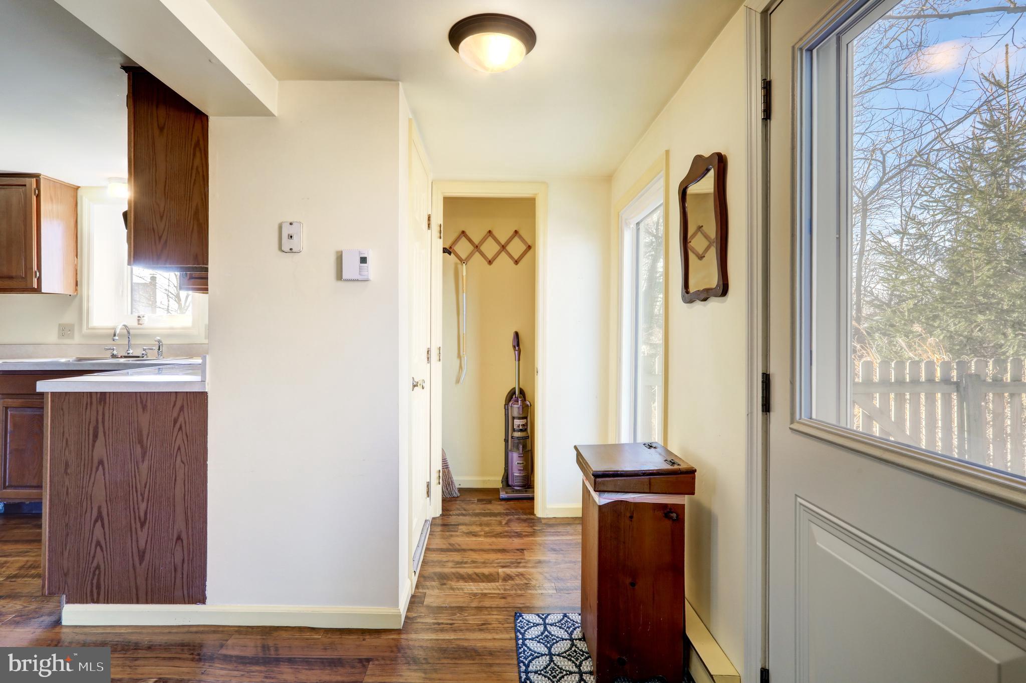 206 Pleasant Hill Drive Lititz, PA 17543 - Photo 22 of 35 a view of a hallway with wooden floor and windows