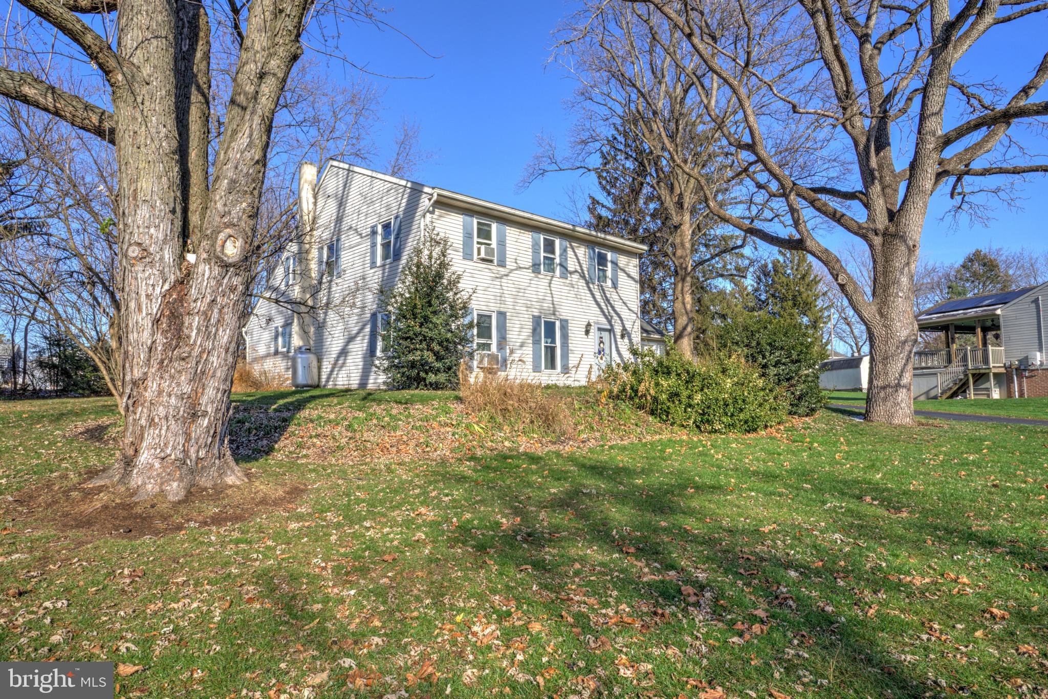 206 Pleasant Hill Drive Lititz, PA 17543 - Photo 4 of 35 a view of a yard with plants and trees